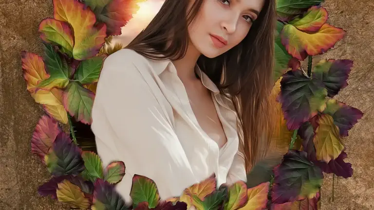 Portrait of a young woman with long brown hair wearing a white blouse, framed by colorful autumn leaves—evoking the mood of fantasy romance recommendations after Fourth Wing.