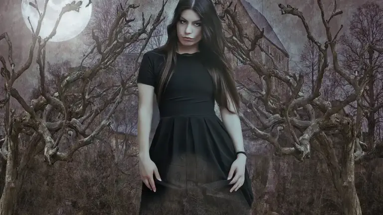 A woman in a black dress stands in a moonlit, eerie forest with twisted bare trees.