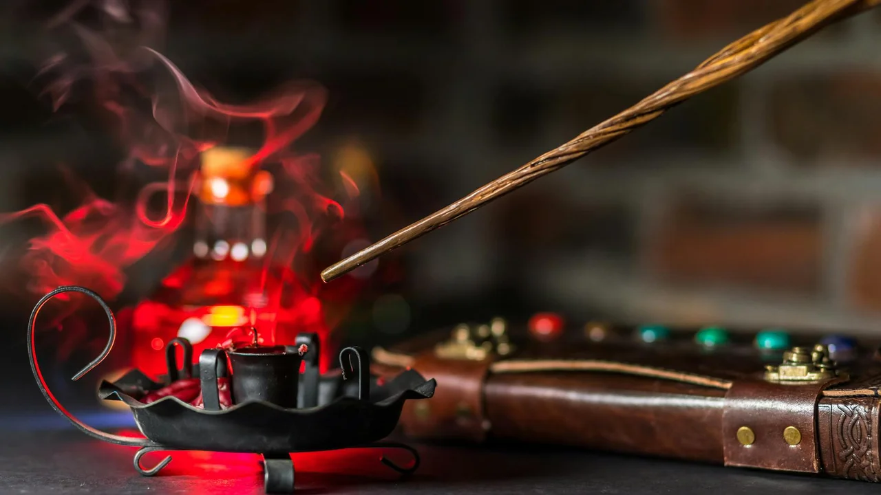 Close-up of an ornate magic oil lamp with a wand resting nearby, a dark wooden surface, and a leather case with colorful beads, evoking fantasy royalty and court intrigue.